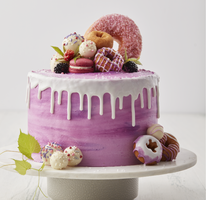 Celebration cake decorated with donut holes and donuts