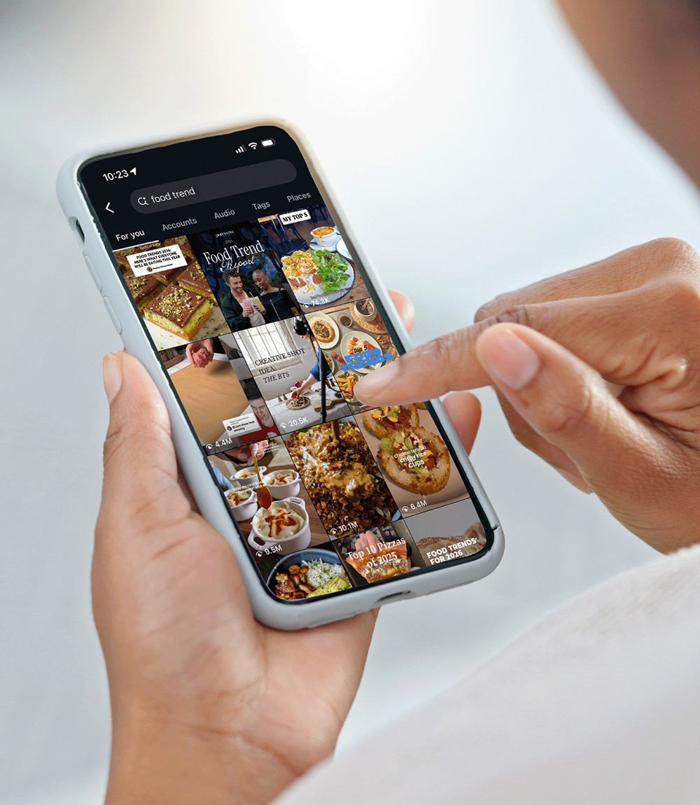 Hands scrolling on a touchscreen cellphone