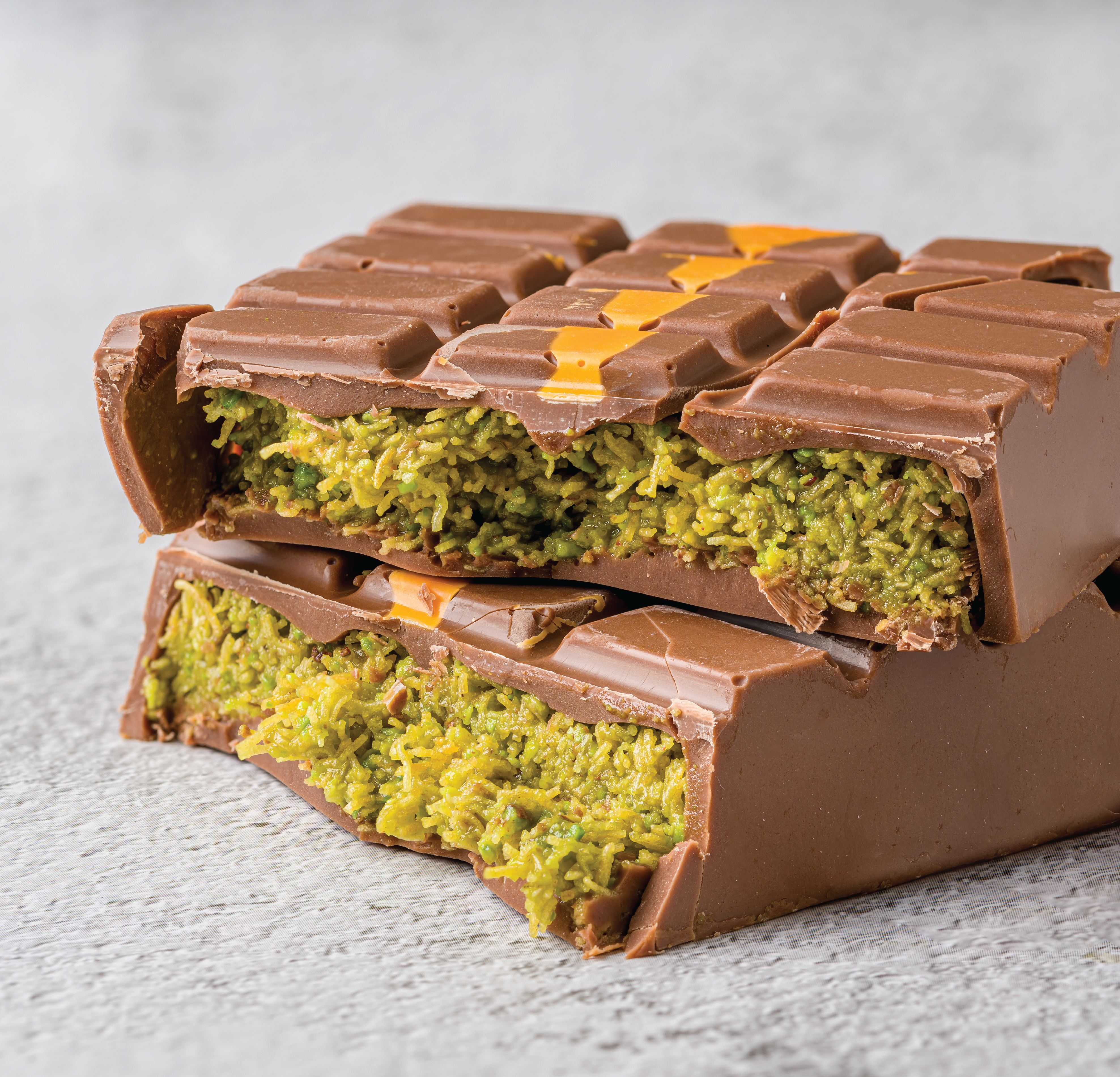 Dubai chocolate bar broken open to show filling